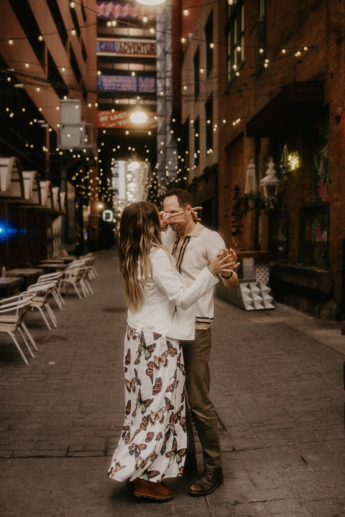 dancing in the street during this downtown Detroit engagement session